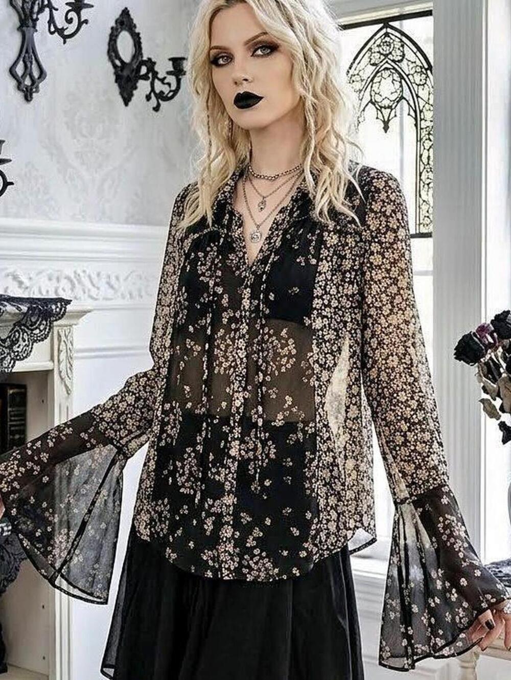 Free People black floral blouse with bell sleeves. Size L